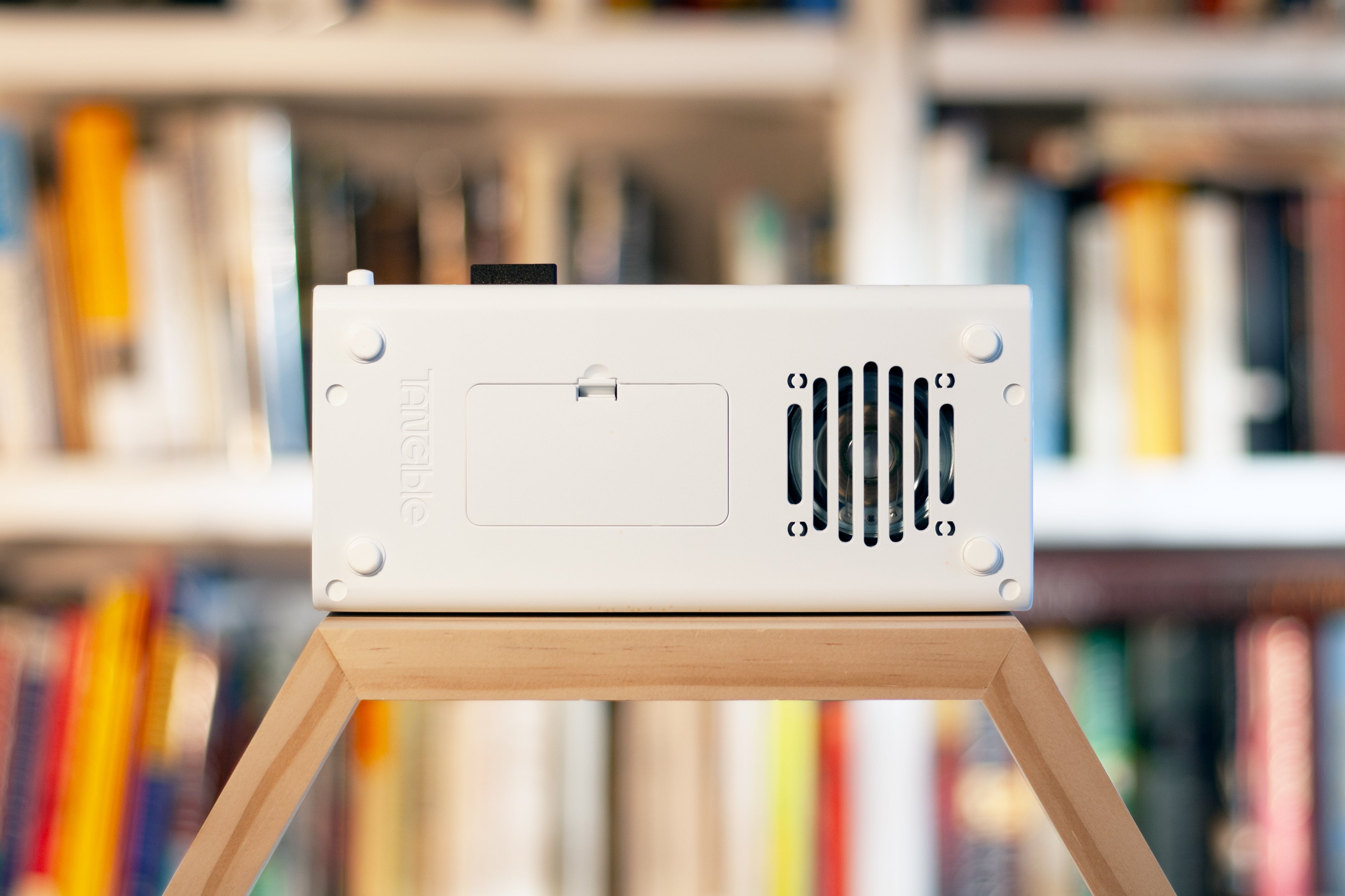 The underside of Arpeggio, showing the built-in speaker and the battery compartment.